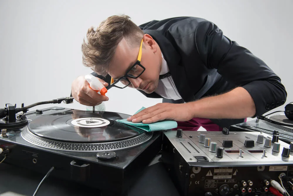 DJ cleaning his turntable